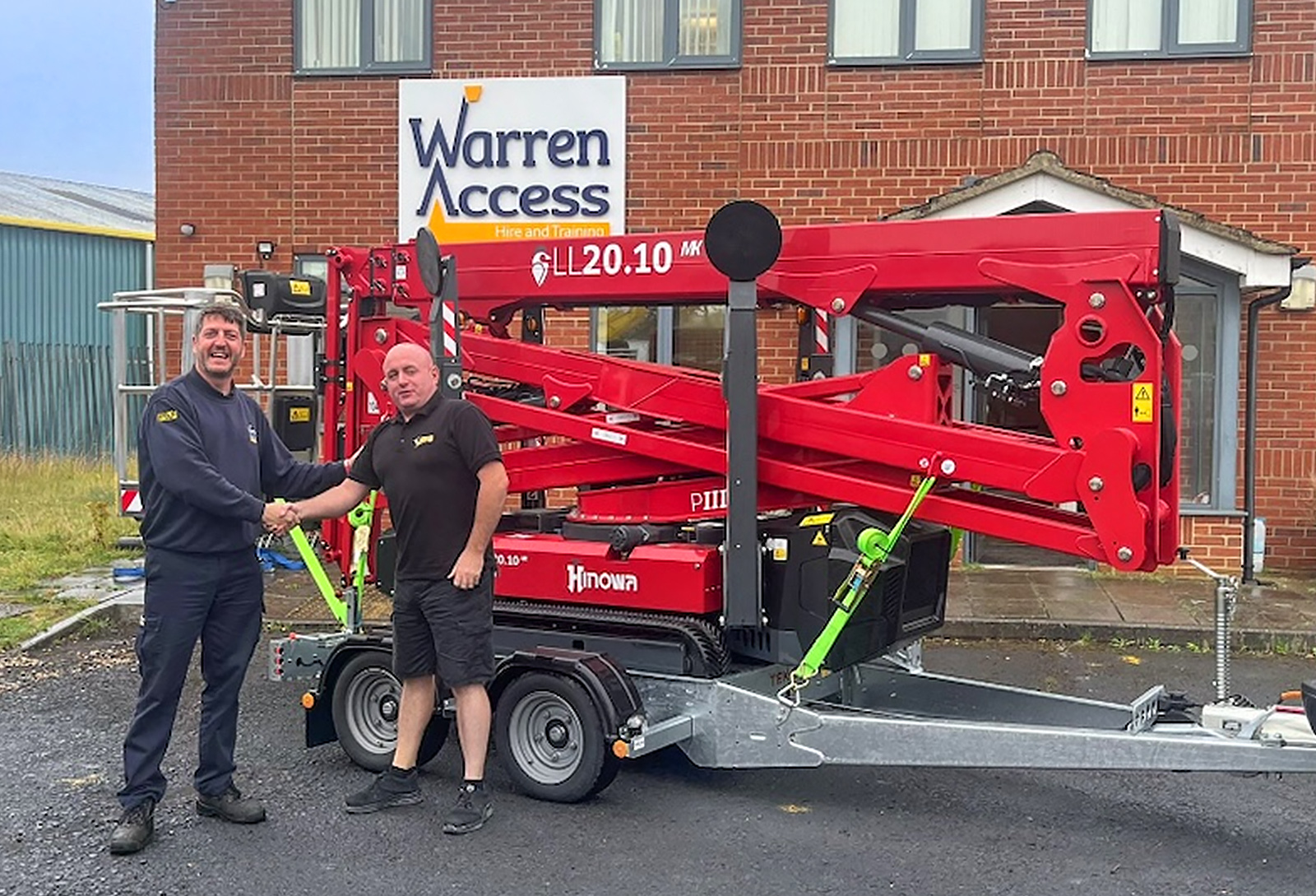 Warren Access Operations Manager Paul Marshall takes delivery of one of the new Hinowa spider lifts from APS driver Nick Johns